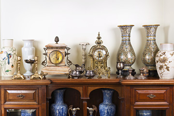 Antique vases and clocks - obrazy, fototapety, plakaty