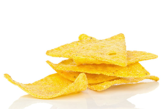 A small pile of tortilla chips on a white background
