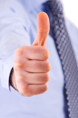 Business man showing thumbs up sign.