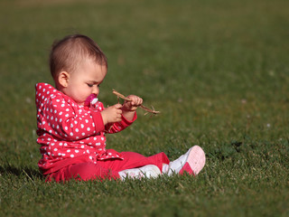 A beautiful child playing in the grass