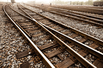 Fototapeta premium Railway in fog on station, outdoor landscape