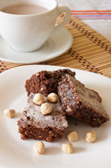 Delicious Chocolate Brownie and Hazelnuts with cocoa milk