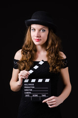 Woman with movie clapper board