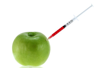 Genetic Modification - Red Liquid injecting to a Green Apple