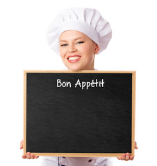 Female chef/ baker holding a menu blackboard for notes. Isolated