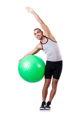 Man with swiss ball doing exercises on white