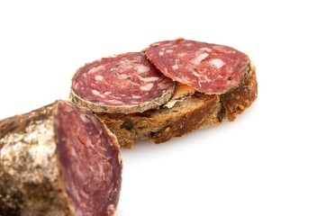Slices of ​​sausage on bread.