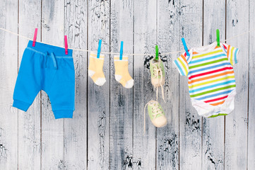 Baby clothes hanging on the clothesline.