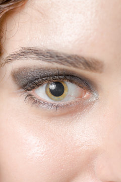 Macro shot of woman's eye with long eyelashes sensual look