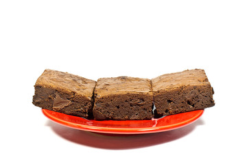 Brownie cake on the red dish