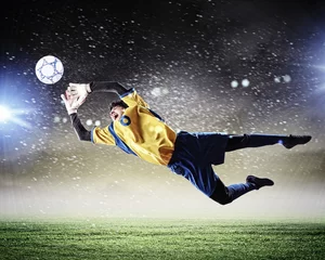 Foto op Aluminium Voetbal Doelman vangt de bal