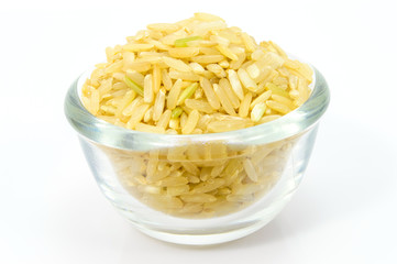 Brown Rice in a glass bowl on white background.