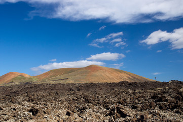 Fototapeta na wymiar The colorful volcanoes in Timanfaya National Park, Lanzarote