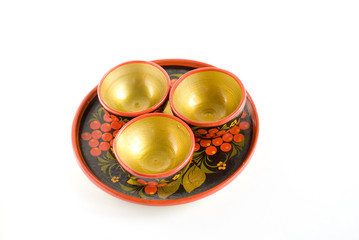 three little porringers and a plate in russian style