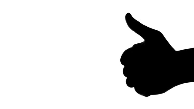 Silhouette of man's hand giving thumb up on white background.