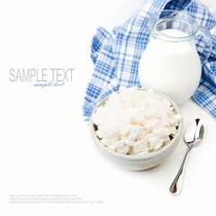 Cottage cheese and milk on white background