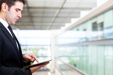 Young businessman working with digital tablet