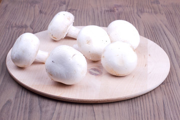 Field mushrooms on a cutting board