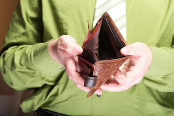 Empty wallet in male hands - poor economy
