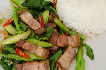Stir-fried kale with crispy pork and rice