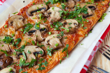 pita baked with sauce and mushrooms