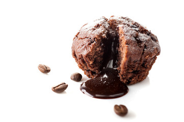 Chocolate muffin with melted chocolate on a white background