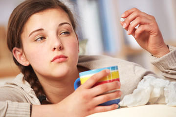 ill teenager girl on the sofa
