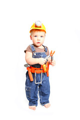 Little boy in an orange helmet and tools on a white background