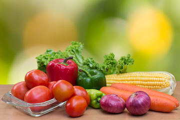 Variety of fresh vegetables on wood table