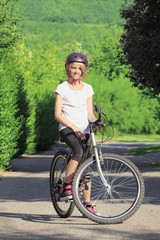 Young girl mountain biking