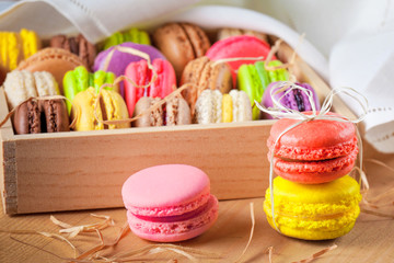 traditional french colorful macarons in a rows in a box