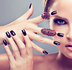 Blonde model  with burgundy manicure