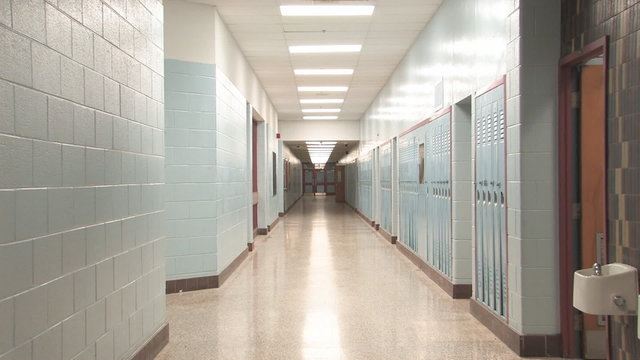 Highschool hallway. Slow zoom.