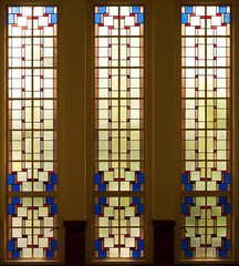 Series of stained glass windows leaving a colourful pattern
