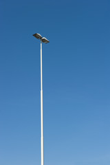 Lamppost at parking of gasstation on highway