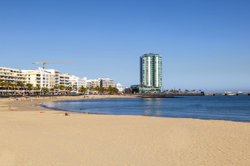 beautiful beach in Arrecife with the town in the background