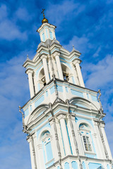 Fototapeta premium High orthodox church on a blue sky background. belfry building