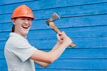 man with axe on blue wooden background