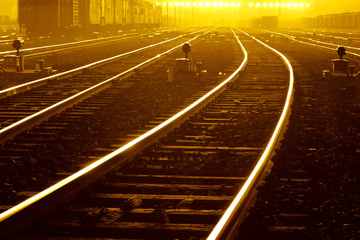 Cargo train platform at sunset with container