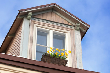 Attic with flowers on the window sill. Tallinn, Estonia