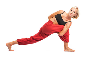 Practicing Yoga. Young woman isolated on white background