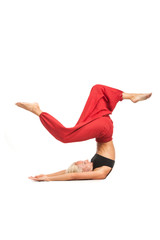 Practicing Yoga. Young woman isolated on white background