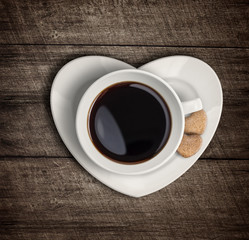 Coffee cup top view on heart shape saucer