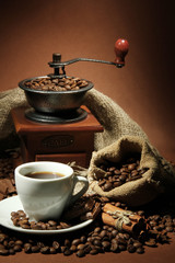 cup of coffee, grinder, turk and coffee beans