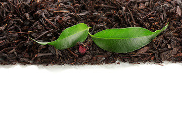 Dry black tea with green leaves, isolated on white