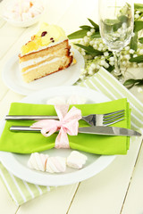 Table setting in white and green tones