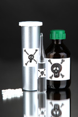 Deadly poison in bottles on black background