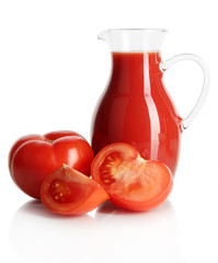 Tomato juice in pitcher isolated on white