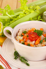 Delicious rice with vegetables and herbs in pot