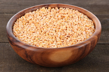 Beans in bowl on wooden background